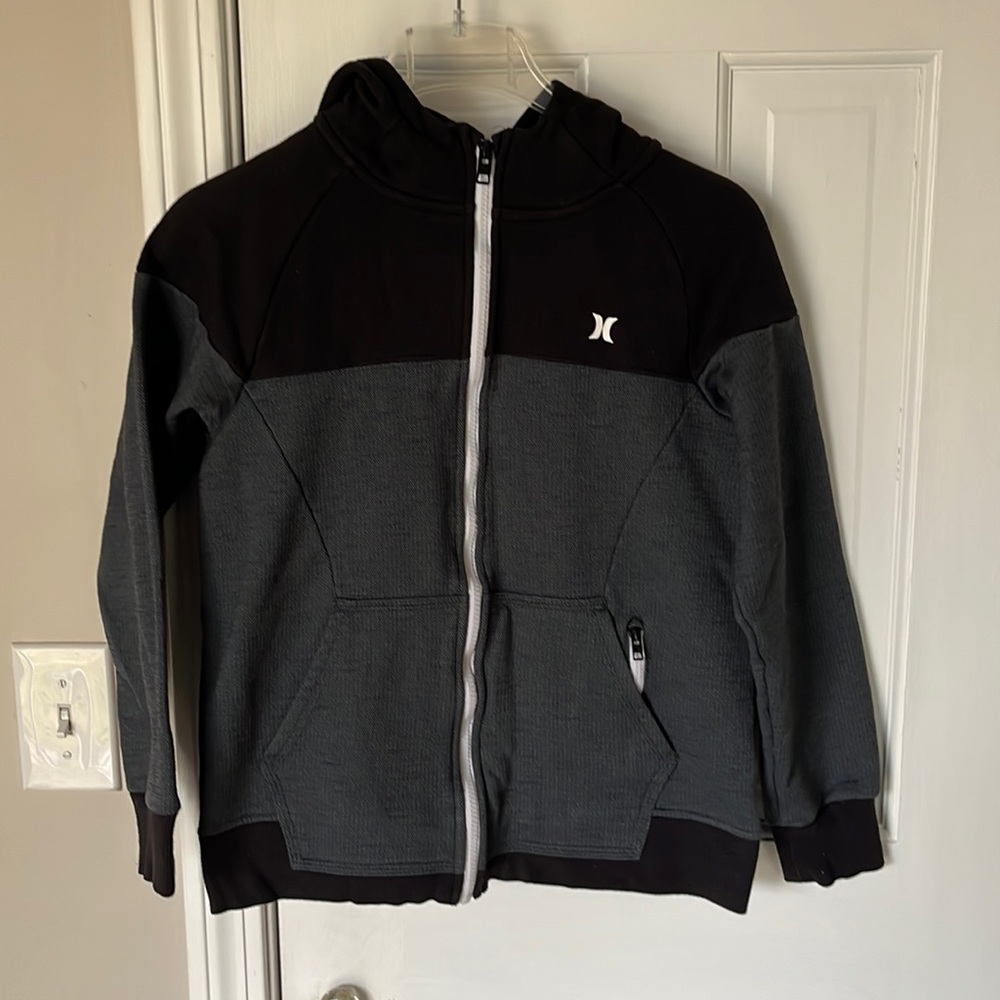Hurley Boys Large. Hooded zip up sweatshirt, with side zipper pocket.